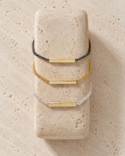 Bracelet Lison Loumaé Bijoux en trois finitions : doré, argent 925 et argent 925 rhodié noir, avec tube en or laminé.